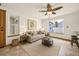 Bright living room with neutral decor, comfortable seating, and ample natural light creating an inviting atmosphere at 8679 Apache Plume Dr, Parker, CO 80134
