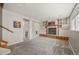 Carpeted living room with built-in shelving and fireplace feature at 8679 Apache Plume Dr, Parker, CO 80134