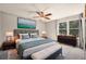 Spacious main bedroom with stylish decor, large windows, and a serene ambiance for restful nights at 8679 Apache Plume Dr, Parker, CO 80134