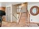 Hardwood staircase leads to the upper level of the home at 8679 Apache Plume Dr, Parker, CO 80134