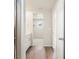 Bathroom featuring a stylish vanity, a walk-in closet and tiled floors at 6571 N Malaya St, Aurora, CO 80019