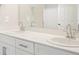 Elegant bathroom featuring a double sink vanity with modern faucets and stylish fixtures at 6571 N Malaya St, Aurora, CO 80019
