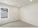Bright bedroom with carpet and a large window at 6571 N Malaya St, Aurora, CO 80019
