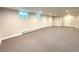 Expansive finished basement with recessed lighting and neutral carpet, ready for customization at 6586 W Leawood Dr, Littleton, CO 80123