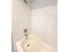 Bathroom shower with subway tile, bathtub, and chrome fixtures providing a clean modern look at 6586 W Leawood Dr, Littleton, CO 80123