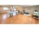 Spacious living area featuring open floorplan, hardwood floors, and modern design elements at 6586 W Leawood Dr, Littleton, CO 80123