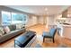 Bright, open-concept home featuring hardwood floors, modern furniture, and plenty of light at 6586 W Leawood Dr, Littleton, CO 80123