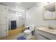 Neat bathroom featuring a shower-tub combination and sink, creating a functional space at 12167 E Exposition Ave, Aurora, CO 80012