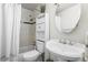 Clean bathroom with a shower-tub combination, toilet, sink and modern fixtures at 12167 E Exposition Ave, Aurora, CO 80012
