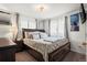 Bright bedroom with large windows and comfortable bed at 12167 E Exposition Ave, Aurora, CO 80012