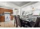 Open kitchen and dining area with views of the well-lit living room at 12167 E Exposition Ave, Aurora, CO 80012