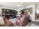 Cozy living area with seamless kitchen view and ample natural light at 12167 E Exposition Ave, Aurora, CO 80012