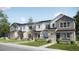 Charming townhomes featuring stone accents, manicured lawns, and inviting entrances for a welcoming curb appeal at 6688 E 149Th Ave # 1, Thornton, CO 80602