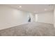 Spacious finished basement with neutral carpeting and recessed lighting at 10763 Lewis Cir, Broomfield, CO 80021