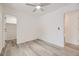 Bright bedroom featuring wood-look flooring, a ceiling fan and closet at 10763 Lewis Cir, Broomfield, CO 80021