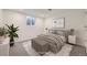 Basement bedroom featuring a queen bed, soft lighting, and neutral decor, creating a cozy retreat at 10763 Lewis Cir, Broomfield, CO 80021
