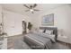 Serene bedroom with minimalist decor, featuring a plush bed, soft rug, and ample closet space at 10763 Lewis Cir, Broomfield, CO 80021