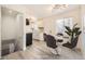 Bright, updated kitchen featuring white cabinets, stainless steel appliances, and a dining area with modern lighting at 10763 Lewis Cir, Broomfield, CO 80021