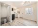 Bright kitchen with a stainless steel appliances, white cabinets, and updated floors at 10763 Lewis Cir, Broomfield, CO 80021