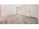 Bright living room with updated floors, white walls, and ample natural light at 10763 Lewis Cir, Broomfield, CO 80021
