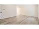 An open-concept living room features neutral walls and updated flooring at 10763 Lewis Cir, Broomfield, CO 80021