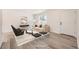 Cozy living room with neutral decor, minimalist furniture, and plenty of natural light, creating an inviting space at 10763 Lewis Cir, Broomfield, CO 80021