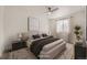 Comfortable bedroom with neutral tones, soft lighting, and a large window, creating a relaxing atmosphere at 10763 Lewis Cir, Broomfield, CO 80021