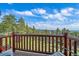 Scenic balcony view overlooking lush greenery and the serene sky, offering a tranquil outdoor experience at 25601 Centennial Trl, Golden, CO 80401