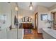Elegant bathroom features a glass shower, double vanity, and luxurious soaking tub at 25601 Centennial Trl, Golden, CO 80401