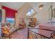 Charming bedroom with skylight, sloped ceiling, vintage furnishings and mountain views from a window at 25601 Centennial Trl, Golden, CO 80401