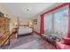 Traditional bedroom with a four-poster bed, decorative curtains and windows that stream natural light at 25601 Centennial Trl, Golden, CO 80401