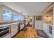 Modern kitchen featuring stainless appliances, granite counters and beautiful views from large windows at 25601 Centennial Trl, Golden, CO 80401