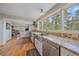 Well-lit kitchen boasts granite countertops, stainless steel appliances, and scenic views at 25601 Centennial Trl, Golden, CO 80401