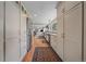 Bright kitchen features white cabinetry, stainless steel appliances, and hardwood floors at 25601 Centennial Trl, Golden, CO 80401