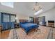 Bright main bedroom with hardwood floors, a chandelier, and ample natural light at 25601 Centennial Trl, Golden, CO 80401