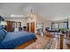 Serene main bedroom features hardwood floors, a sitting area, and a cozy fireplace at 25601 Centennial Trl, Golden, CO 80401