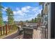 Inviting outdoor deck featuring comfortable seating and beautiful mountain views on a sunny day at 25601 Centennial Trl, Golden, CO 80401
