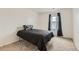 Simple bedroom with a bed and neutral colors at 303 Diablo Pl, Brighton, CO 80603