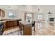 Open kitchen with a center island perfect for entertaining, flows into living room at 303 Diablo Pl, Brighton, CO 80603