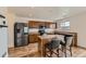 Spacious kitchen with stainless steel appliances, a center island, and ample storage at 303 Diablo Pl, Brighton, CO 80603