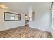 Open-concept room featuring beautiful wood floors and natural light at 303 Diablo Pl, Brighton, CO 80603