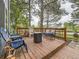 Outdoor back deck features lots of seating and is surrounded by mature trees at 11523 Sandy Creek Ln, Parker, CO 80138