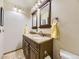 Bathroom with double sinks, framed mirrors, vanity and a tiled floor at 11523 Sandy Creek Ln, Parker, CO 80138