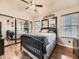 Bedroom features hardwood floors, a ceiling fan and a sliding mirrored closet at 11523 Sandy Creek Ln, Parker, CO 80138