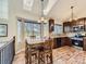 Bright kitchen featuring wood floors, a large table, stainless steel appliances, skylights and ample natural light at 11523 Sandy Creek Ln, Parker, CO 80138