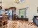 Open-concept kitchen with stainless steel appliances, dark wood cabinets, large window and seating area at 11523 Sandy Creek Ln, Parker, CO 80138