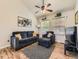 Inviting living room featuring comfortable seating, a ceiling fan, and natural light streaming through the window at 11523 Sandy Creek Ln, Parker, CO 80138