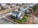 An aerial view of a home featuring an artificial turf backyard, a back patio, and a charming fence at 16402 E Tennessee Ave, Aurora, CO 80017