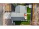 Overhead shot of the property featuring an artificial turf backyard, patio, and neatly landscaped front yard at 16402 E Tennessee Ave, Aurora, CO 80017