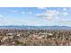 Scenic aerial showcasing the city skyline and snow-capped mountain views in the background at 16402 E Tennessee Ave, Aurora, CO 80017